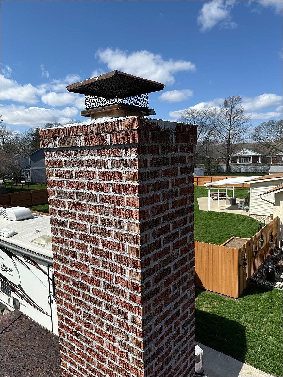 Brick chimney with a cap on a GTA home