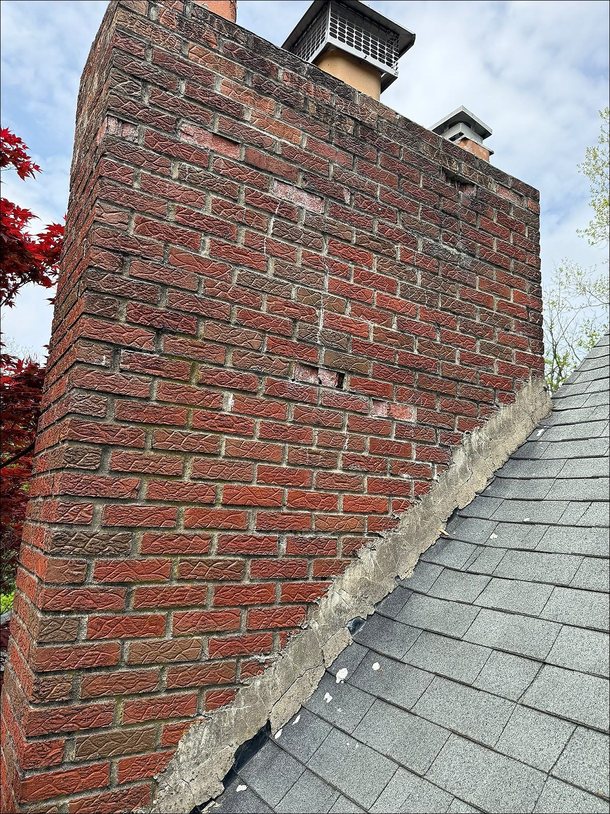 Before: brick chimney with washed-out mortar joints