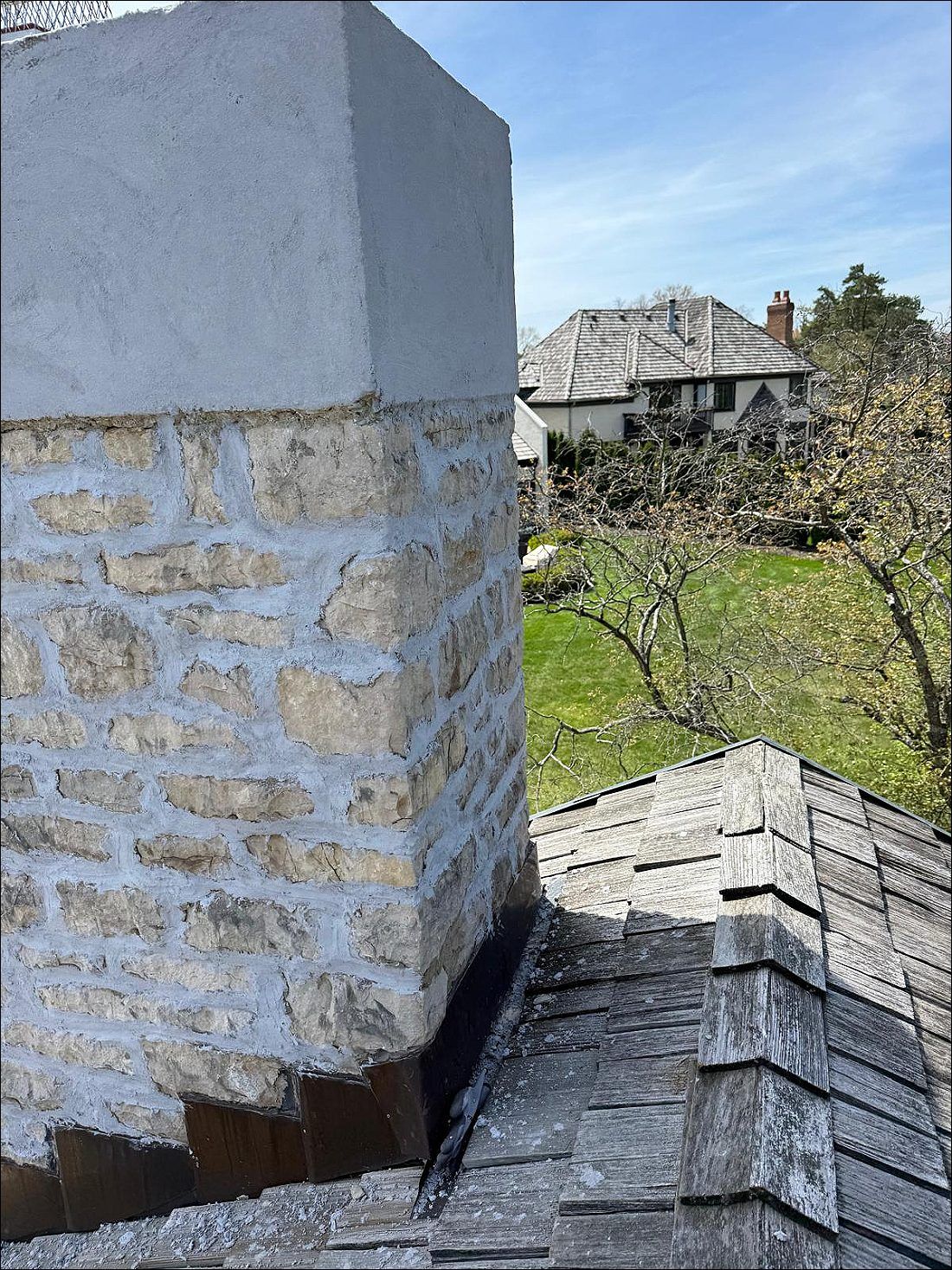 Before: stone chimney with a worn crown and weathered joints